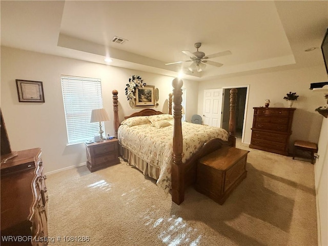 2103 W George, Pocola, OK 74902 - carpeted bedroom featuring a raised ceiling, baseboards, and a ceiling fan