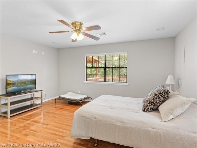 bedroom featuring hardwood / wood-style floors and ceiling fan