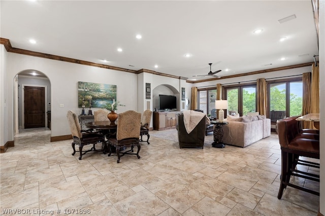 dining room featuring ceiling fan and crown molding