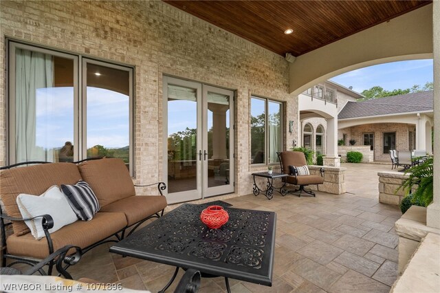 view of patio with french doors and an outdoor hangout area