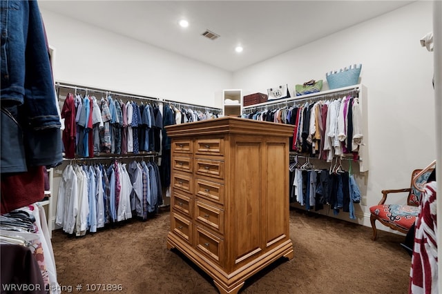 spacious closet featuring dark carpet