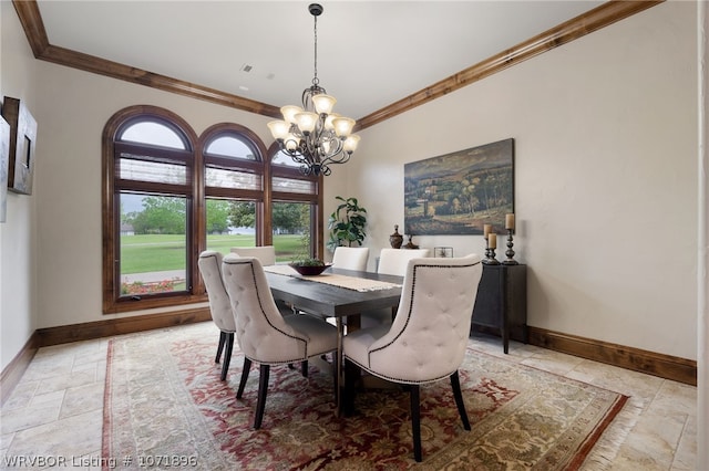 dining space with an inviting chandelier and ornamental molding