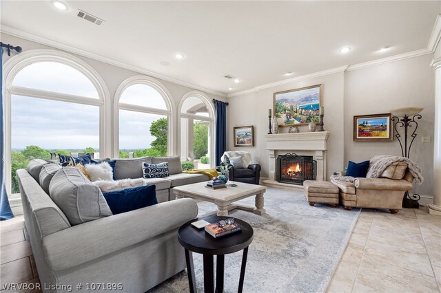 living room with crown molding and light tile patterned flooring