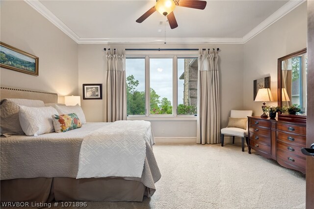 carpeted bedroom featuring multiple windows, ceiling fan, and ornamental molding