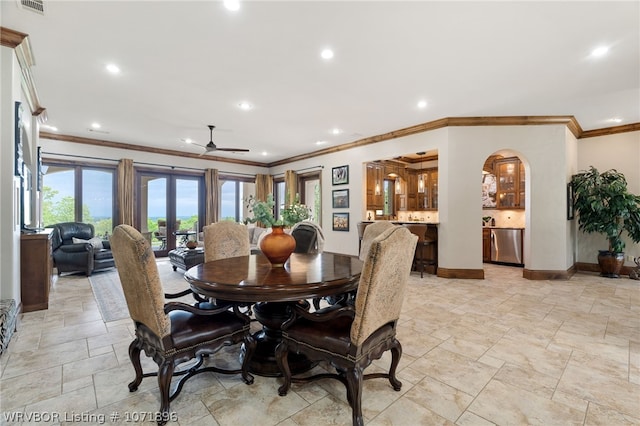 dining space with french doors, ceiling fan, and ornamental molding