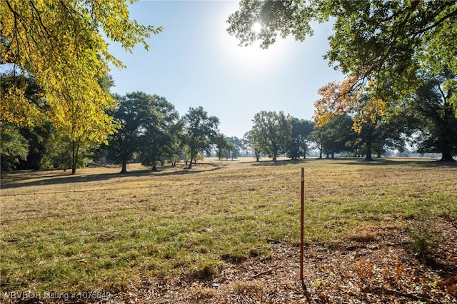 view of yard with a rural view