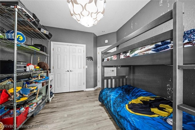 bedroom featuring a closet and hardwood / wood-style floors