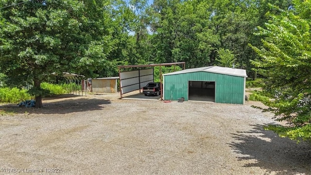 3204 W George, Pocola, OK 74902 - view of outbuilding with driveway and a carport