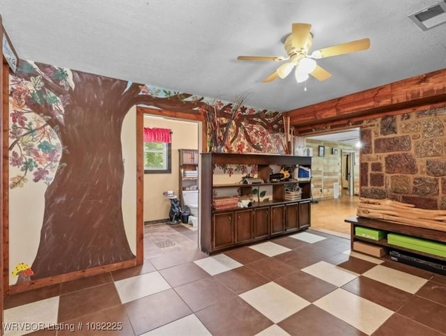 3204 W George, Pocola, OK 74902 - bar with arched walkways, ceiling fan, and a textured ceiling