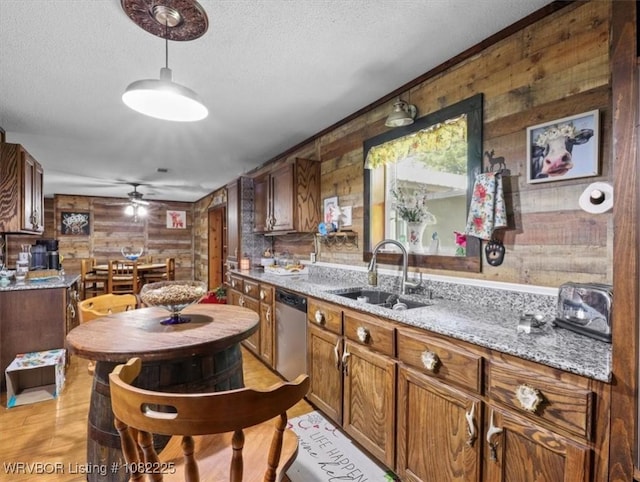 3204 W George, Pocola, OK 74902 - kitchen featuring stainless steel dishwasher, a ceiling fan, a textured ceiling, pendant lighting, and light stone counters