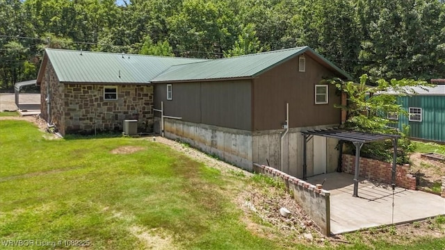 3204 W George, Pocola, OK 74902 - rear view of property featuring a yard, a patio area, and a metal roof