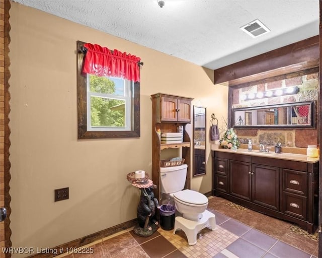 3204 W George, Pocola, OK 74902 - bathroom featuring vanity, a textured ceiling, and tile patterned flooring