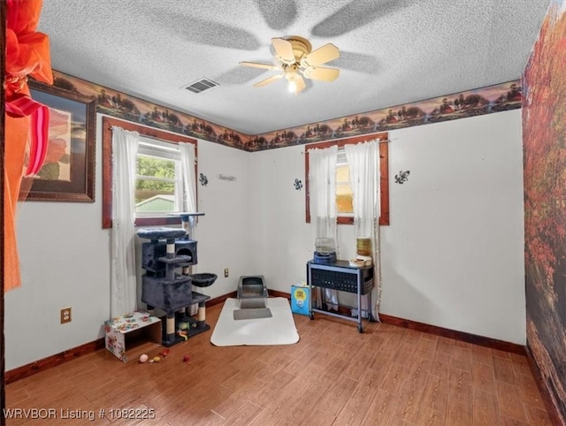 3204 W George, Pocola, OK 74902 - office with a ceiling fan, wood finished floors, and a textured ceiling