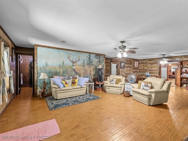 3204 W George, Pocola, OK 74902 - living room with a ceiling fan, a textured ceiling, and wood finished floors