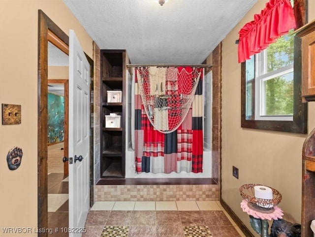3204 W George, Pocola, OK 74902 - full bath featuring curtained shower, a textured ceiling, and tile patterned floors
