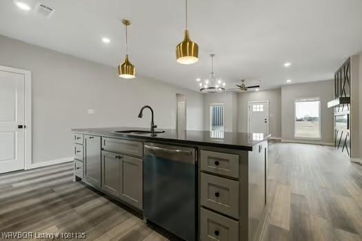 2018 Yellowstone Dr, Barling, AR 72903 - kitchen featuring dishwasher, a sink, gray cabinets, dark countertops, and dark wood-type flooring