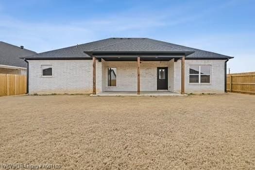 2018 Yellowstone Dr, Barling, AR 72903 - back of property with a patio area and a fenced backyard