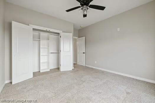 2018 Yellowstone Dr, Barling, AR 72903 - unfurnished bedroom featuring carpet flooring, a closet, baseboards, and ceiling fan