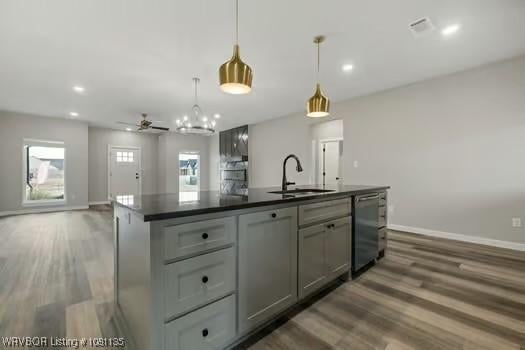 2018 Yellowstone Dr, Barling, AR 72903 - kitchen with a sink, dishwashing machine, dark countertops, ceiling fan, and wood finished floors