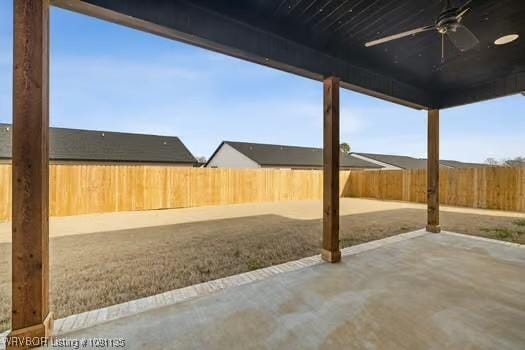 2018 Yellowstone Dr, Barling, AR 72903 - fenced backyard with a ceiling fan and a patio