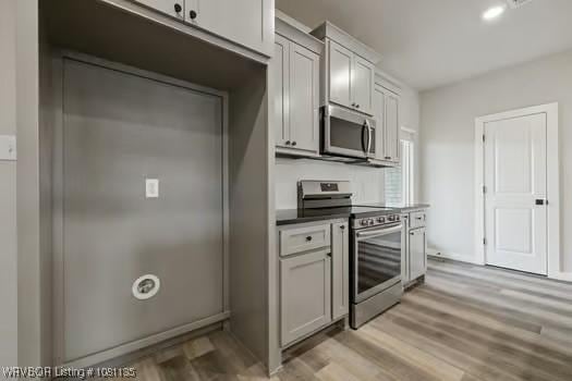 2018 Yellowstone Dr, Barling, AR 72903 - kitchen with appliances with stainless steel finishes and light wood-style floors