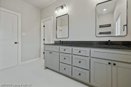 2018 Yellowstone Dr, Barling, AR 72903 - bathroom featuring double vanity and baseboards
