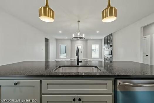 2018 Yellowstone Dr, Barling, AR 72903 - kitchen featuring dishwasher, a sink, dark stone counters, and decorative light fixtures