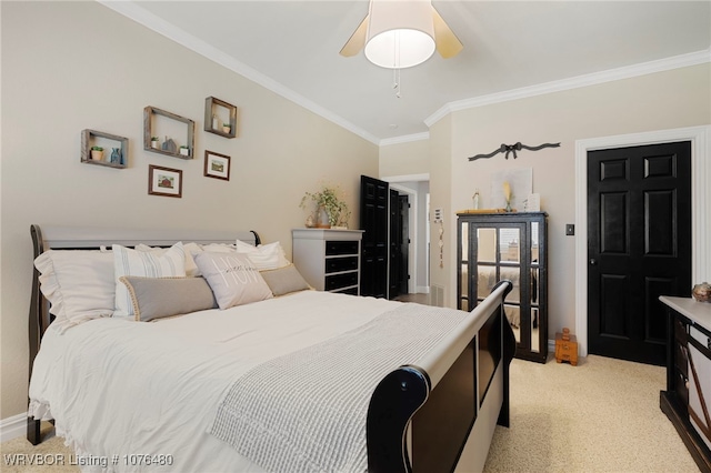 carpeted bedroom with ceiling fan and crown molding