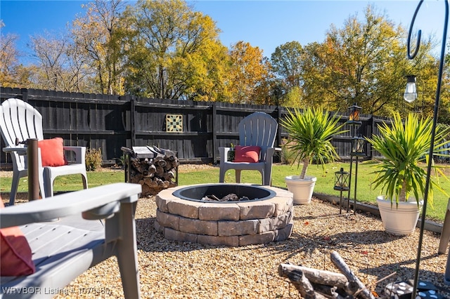 view of yard with a fire pit