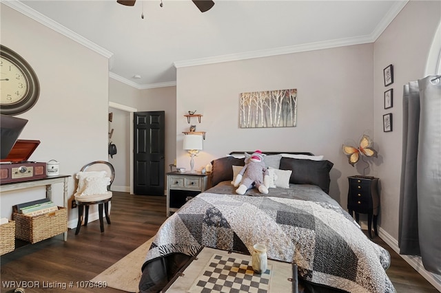 bedroom featuring dark hardwood / wood-style floors, ceiling fan, and ornamental molding