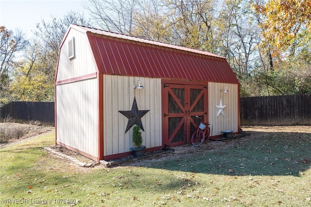 view of outbuilding with a lawn