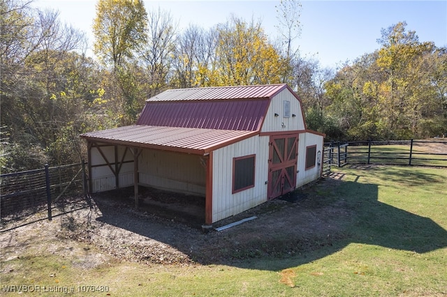 view of outbuilding featuring a yard