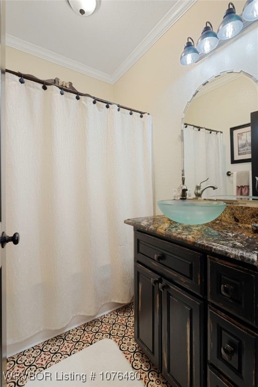 bathroom with tile patterned flooring, vanity, and ornamental molding