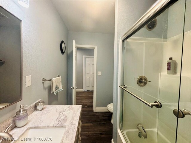 420 Wheeler Ave, Sallisaw, OK 74955 - bathroom with toilet, baseboards, wood finished floors, and vanity