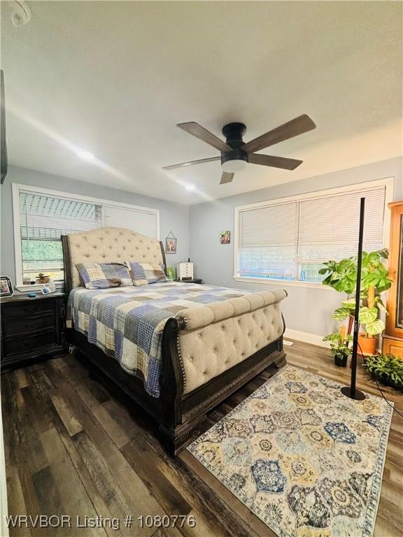 420 Wheeler Ave, Sallisaw, OK 74955 - bedroom featuring dark wood-type flooring and a ceiling fan
