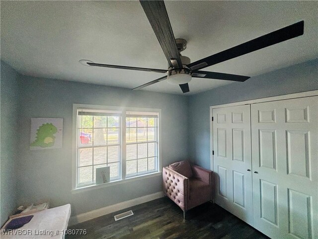 420 Wheeler Ave, Sallisaw, OK 74955 - bedroom with a ceiling fan, a closet, baseboards, visible vents, and dark wood-style floors