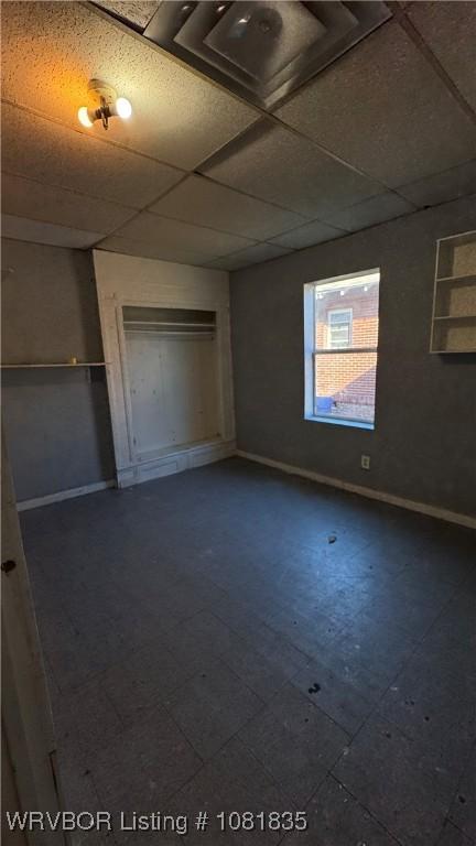515 N 12th St Unit A & B, Fort Smith, AR 72901 - unfurnished bedroom with a paneled ceiling and baseboards