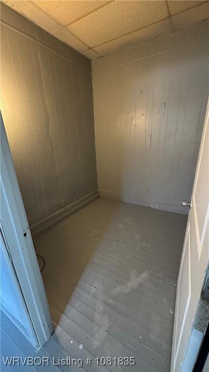 515 N 12th St Unit A & B, Fort Smith, AR 72901 - empty room with a drop ceiling and wooden walls