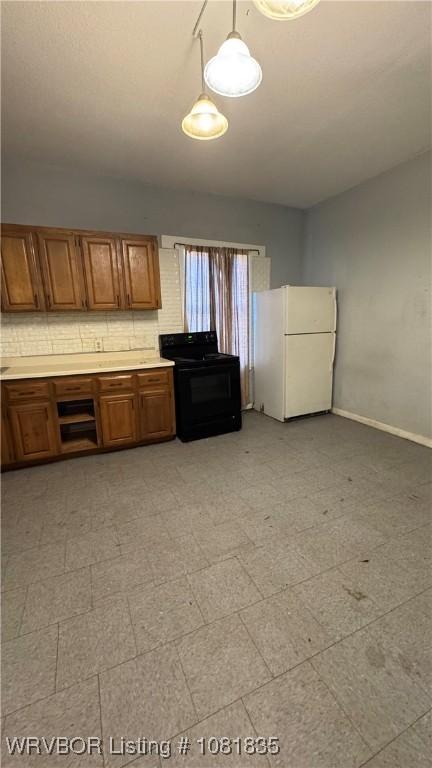 515 N 12th St Unit A & B, Fort Smith, AR 72901 - kitchen featuring freestanding refrigerator, electric range, brown cabinets, light flooring, and light countertops