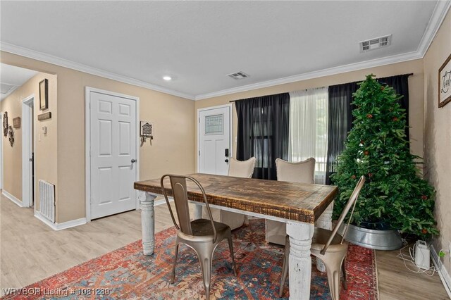2128 N 53rd St, Fort Smith, AR 72904 - dining space featuring light wood finished floors, baseboards, ornamental molding, and recessed lighting