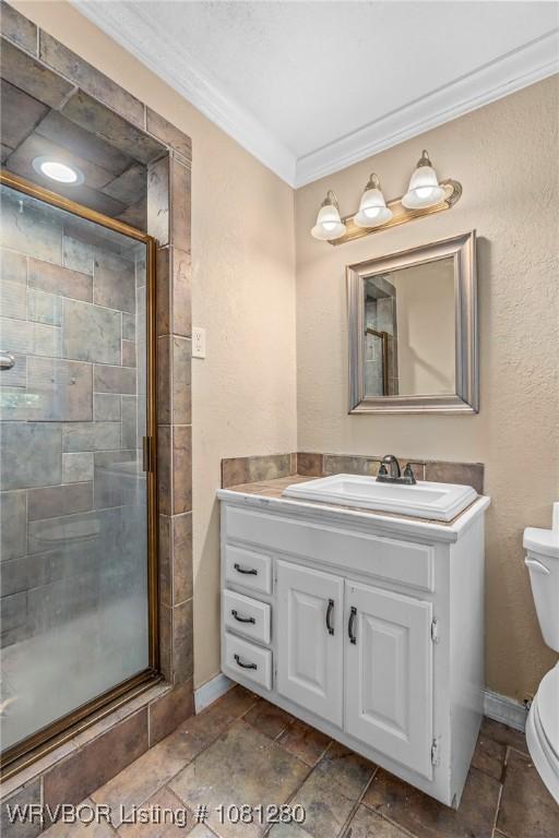 2128 N 53rd St, Fort Smith, AR 72904 - full bathroom featuring ornamental molding, a stall shower, toilet, vanity, and baseboards