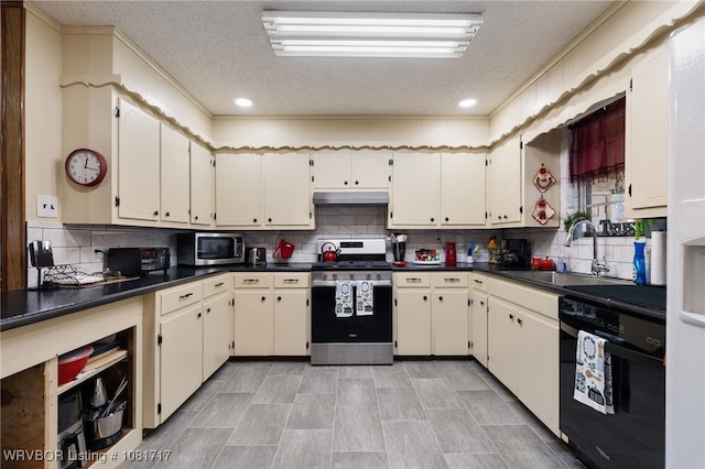 406 Hamilton St, Poteau, OK 74953 - kitchen featuring appliances with stainless steel finishes, dark countertops, a textured ceiling, backsplash, and under cabinet range hood
