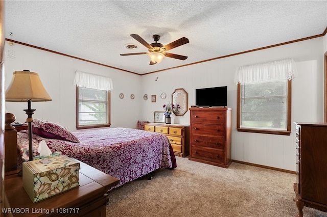 406 Hamilton St, Poteau, OK 74953 - carpeted bedroom featuring crown molding, ceiling fan, and a textured ceiling