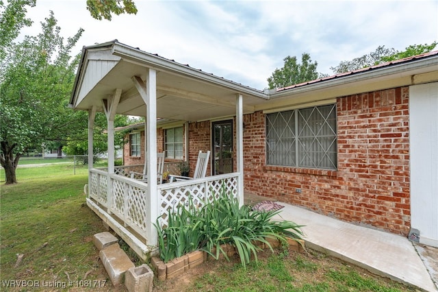 406 Hamilton St, Poteau, OK 74953 - porch featuring a yard