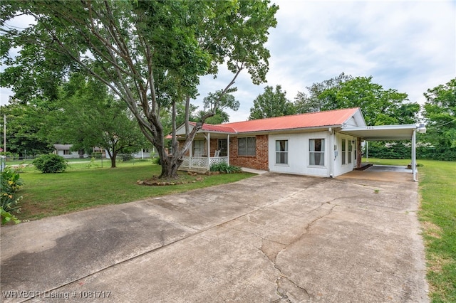 406 Hamilton St, Poteau, OK 74953 - view of front of property featuring concrete driveway, a front lawn, a metal roof, and a porch