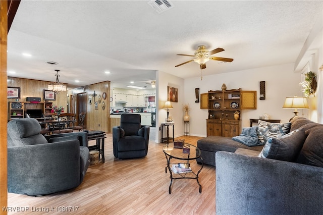 406 Hamilton St, Poteau, OK 74953 - living area with a ceiling fan, light wood-type flooring, a chandelier, and recessed lighting