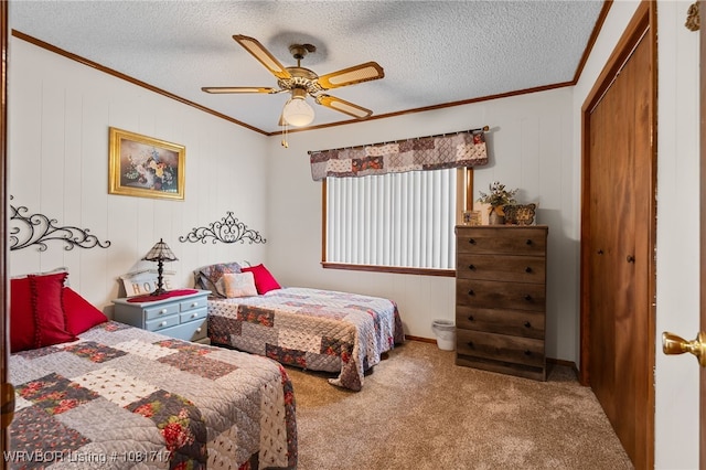 406 Hamilton St, Poteau, OK 74953 - bedroom featuring crown molding, carpet floors, a closet, a textured ceiling, and ceiling fan