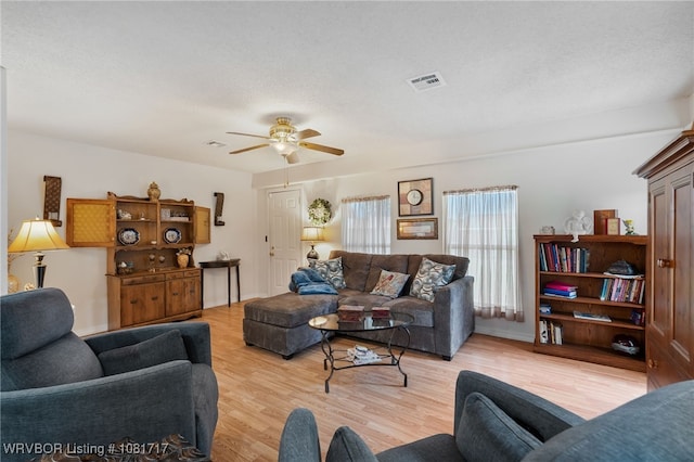 406 Hamilton St, Poteau, OK 74953 - living room featuring light wood-type flooring and ceiling fan