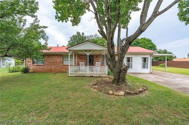 406 Hamilton St, Poteau, OK 74953 - ranch-style home featuring a metal roof, concrete driveway, covered porch, and brick siding