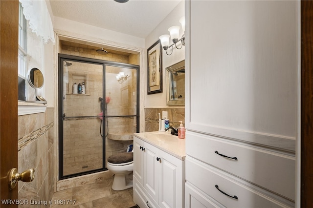 406 Hamilton St, Poteau, OK 74953 - full bath with vanity, tile walls, a stall shower, and tile patterned flooring